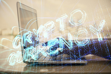 Double exposure of woman hands typing on computer and crypto market theme hologram drawing....