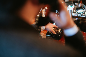 
A man dials numbers on an old phone