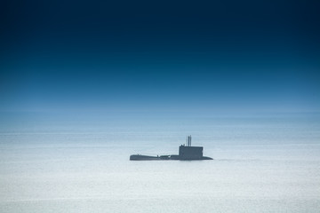 View of a submarine underway on the ocean © christian vinces