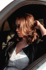 Fototapeta na wymiar young woman in car