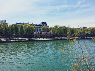Paris, France circa January, 2020: Banks of River Seine, historical buildings and classic...