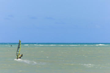 A lonely windsurfer on the water