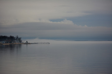 Fog floating over the Potomac River in Colonial Beach, Virginia.