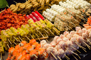Assorted street food in bright orange colors