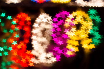 Bokeh shot of a bright and colorful christmas lantern/parol star shapes