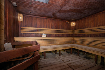 Sauna and sauna accessories on an interior background