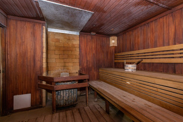 Obraz na płótnie Canvas Sauna and sauna accessories on an interior background