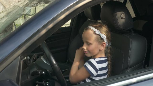 Girl Sitting In A Car And Dancing Listening To Music