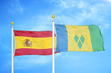 Spain and Saint Vincent and the Grenadines two two flags on flagpoles