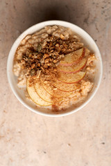 Porridge with Apple Slices and Granola Bowl Copy Space