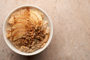 Bowl of Porridge with Apple and Granola Copy Space