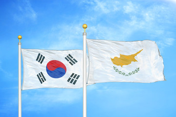 South Korea and Cyprus two flags on flagpoles and blue cloudy sky