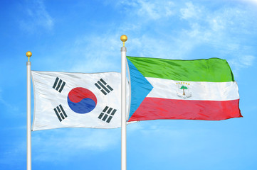 South Korea and Equatorial Guinea two flags on flagpoles and blue cloudy sky