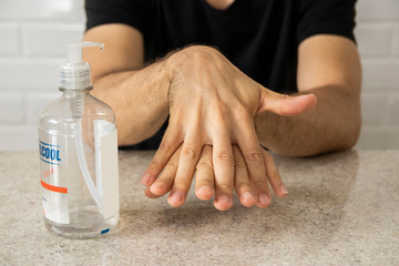 Coronavirus prevention. Man using alcohol gel for hand hygiene. Hygiene concept. Novel coronavirus. (2019-nCoV). Covid-19.
