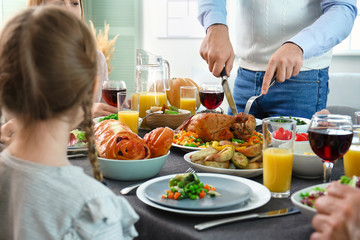 Family celebrating Thanksgiving Day at home