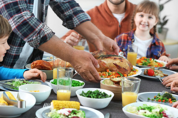 Family celebrating Thanksgiving Day at home