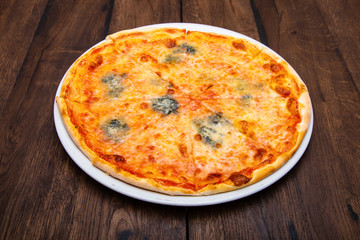 Classic Italian pizza on a wooden table