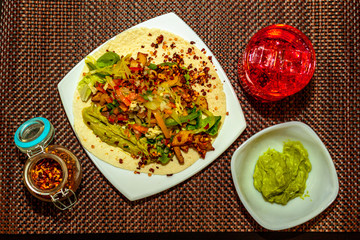 Aerial shot of a taco with its ingredients in sight
