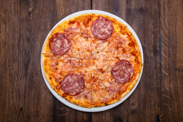 Classic Italian pizza on a wooden table