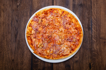 Classic Italian pizza on a wooden table