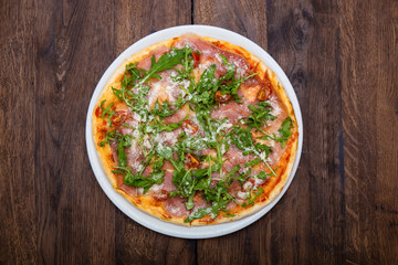 Classic Italian pizza on a wooden table