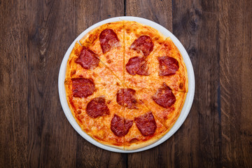 Classic Italian pizza on a wooden table