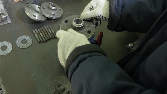 Install the Gasket in the Valve. Hands in Gloves
