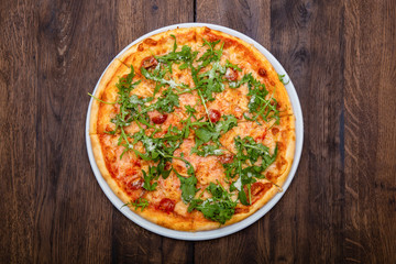 Classic Italian pizza on a wooden table