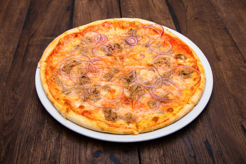 Classic Italian pizza on a wooden table