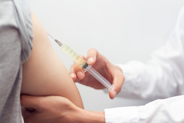 Medicine and health care concept Doctor giving patient vaccine insulin for protect virus