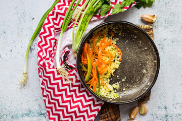 Finished lunch or dinner. Food left in dirty unclean bowl with traces, pieces of vegetables salad. Vegan food