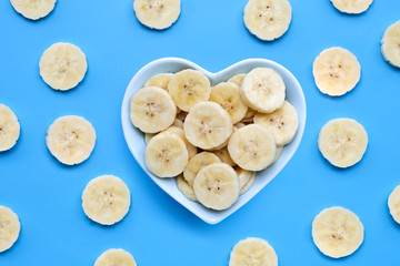 Banana slices on blue background.