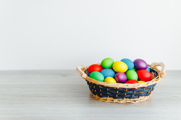 Fototapeta na wymiar Easter color eggs in festive gift basket