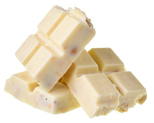 Broken white chocolate with whole hazelnut nuts Isolated