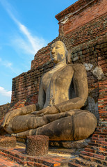 Old big Buddha statue in archaeological site Sukhothai, Thailand