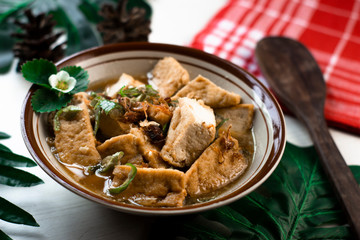 Indonesian cooked tofu with sesame seeds and spices