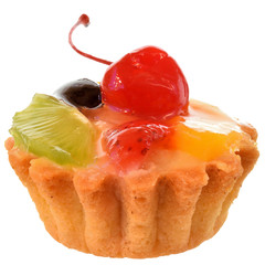 Fruit cake in a sand basket with cream decorated with cherry