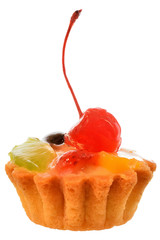 Fruit cake in a sand basket with cream decorated with cherry