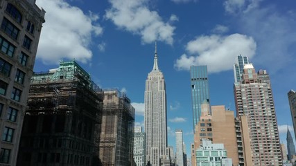 view of Empire State Bldg flying bkwd tilting down to empty Mad Sq Park Covid-19