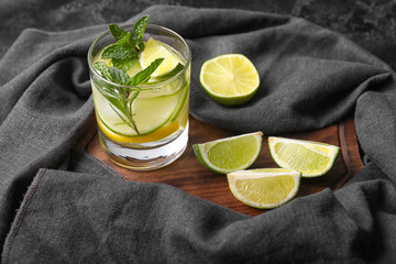 Glass of fresh lime lemonade on table