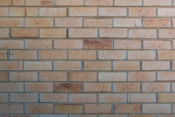 Subtle textured cream brick wall, stretcher bond