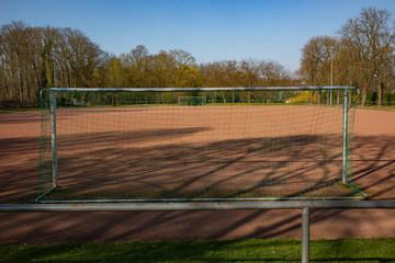 Fototapeta premium empty football ground in the sun based on championship interruption because of corona