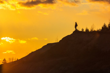 man on top of a mountain sunset harmony adventure