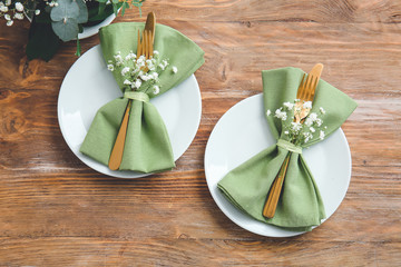 Beautiful table setting on wooden background