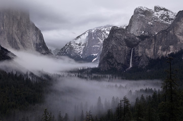 Clearing winter storm with clouds and fog in Yosemite Valley from Tunnel View
