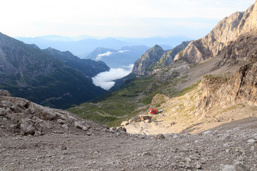 Alpine hut Rifugio Agostini and mountain alps panorama in Brenta Dolomites, Italy