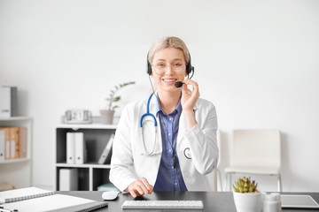 Female doctor giving a consultation online in clinic