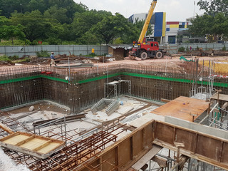 Building substructure and super-structure under construction using the open-cut method. It is commencing after the foundation stage using the conventional method