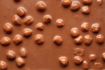 Sweet chocolate with nuts as background