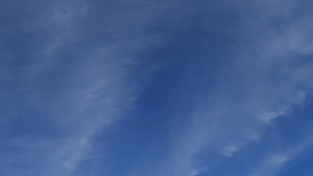 Beautiful white smoky fluffy cirrus & cumulus clouds on tropical summer or spring bright blue sky background in sunny day TimpLapse for transitional & meditative motion vdo or nature related project